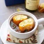 It's easy to make this delicious French Onion Soup with a few simple steps and in a slow cooker. Add a thick piece of bread and cheese for a tasty topping!