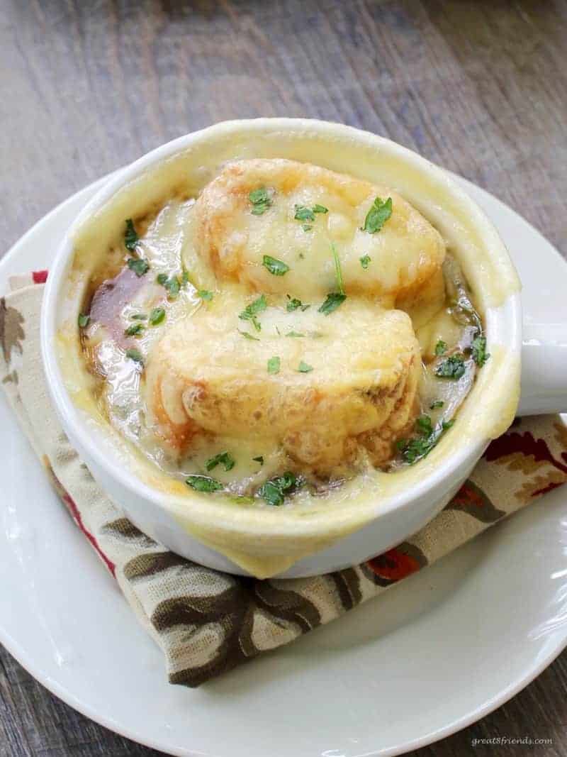 French Onion Soup topped with bread and melted cheese.