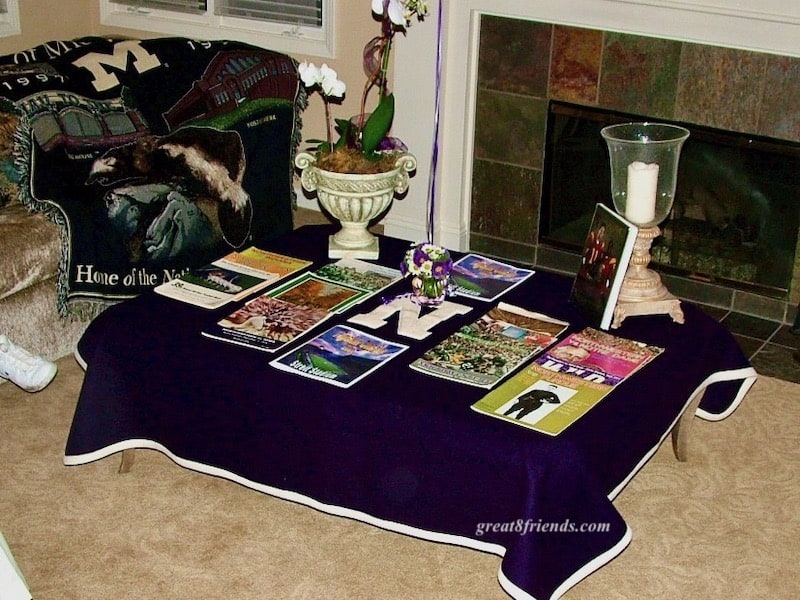 Coffee Table covered with football programs.