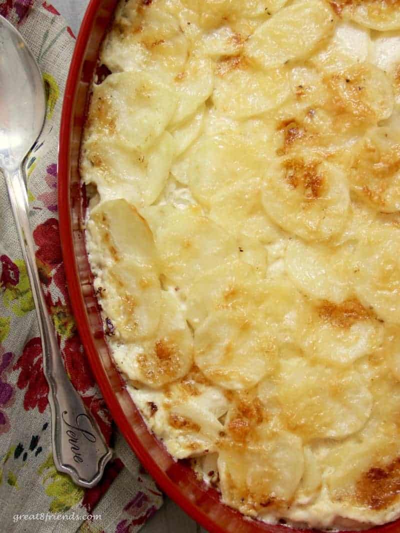 This Idaho Potato Gratin is flavorful, cheesy and a perfect side dish for meat, chicken or fish. The perfect make-ahead of time recipe!