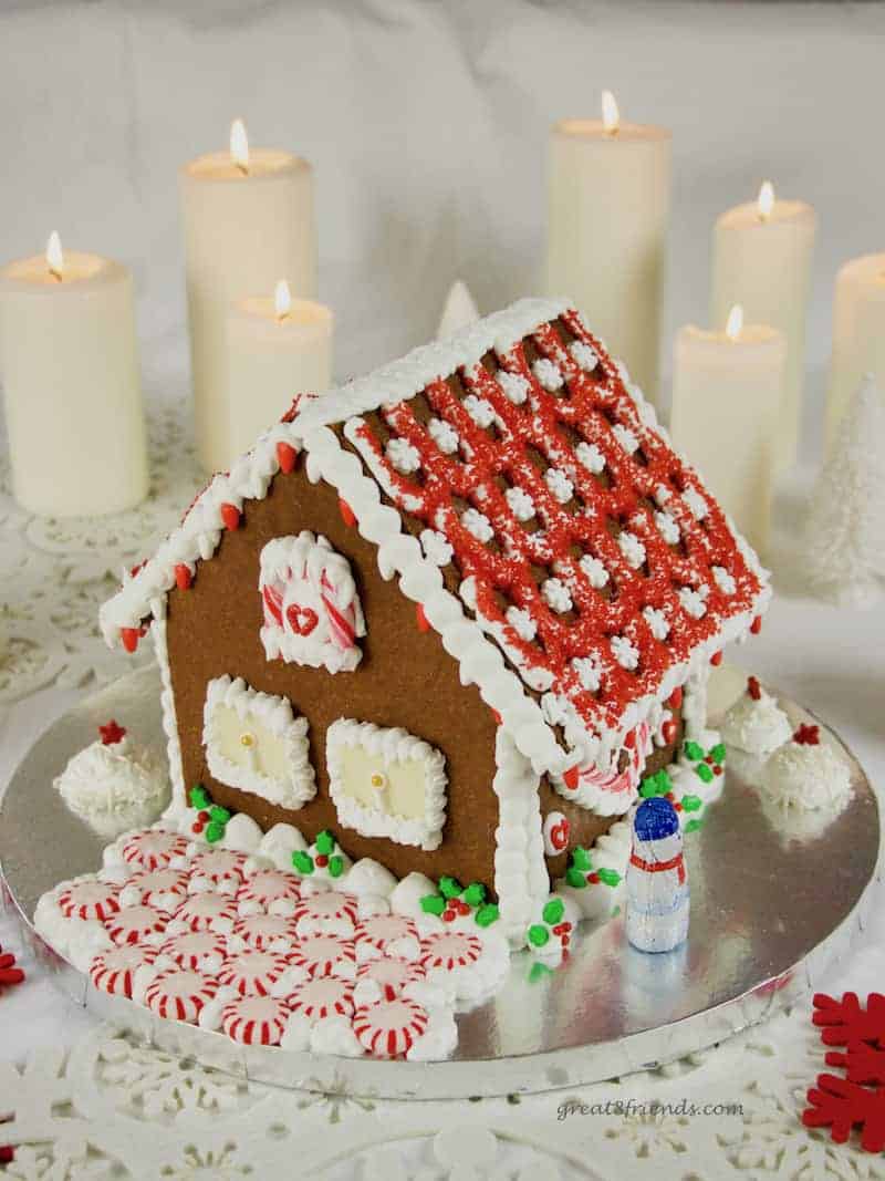 Don't buy a kit, add whimsy and fun to your Christmas by making this DIY Festive Gingerbread House! All the instructions right here.
