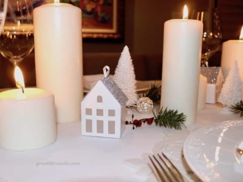 A Danish Christmas Dinner centerpiece white candles small house