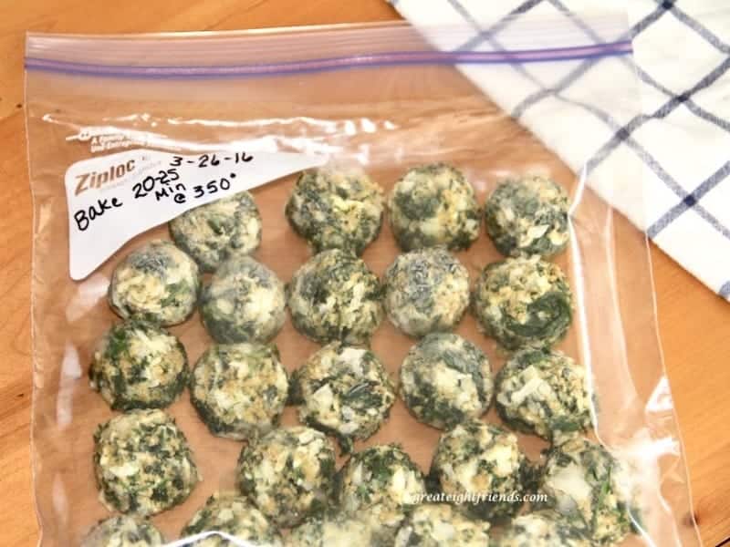 Super Simple Spinach Balls, the name says it all. Make these, freeze them, then you have the perfect appetizer ready to pop in the oven for any occasion.