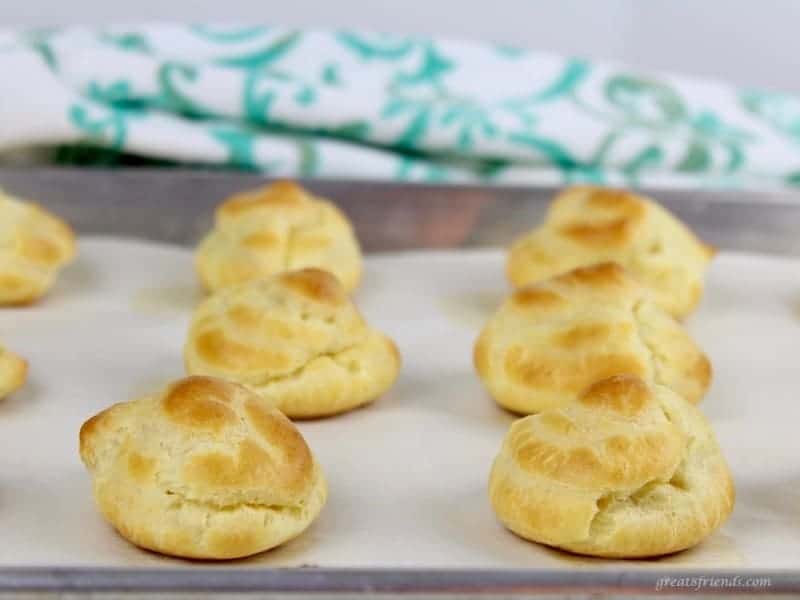 Baked Profiteroles on a baking sheet.