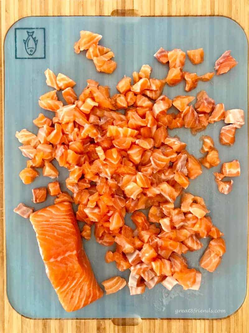 Chopped fresh raw salmon for salmon sliders.