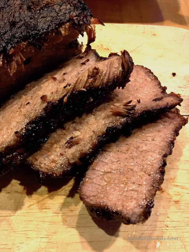 A close up of sliced smoked brisket.