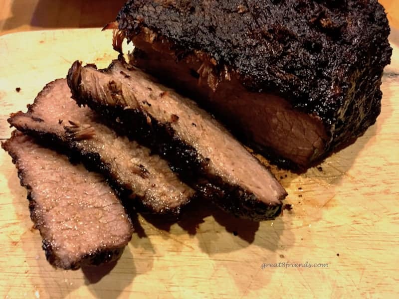 Sliced brisket on a board.