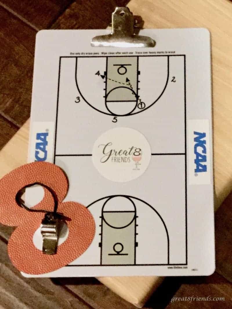 Coach's clipboard for NCAA with a cut out 8 and whistle.