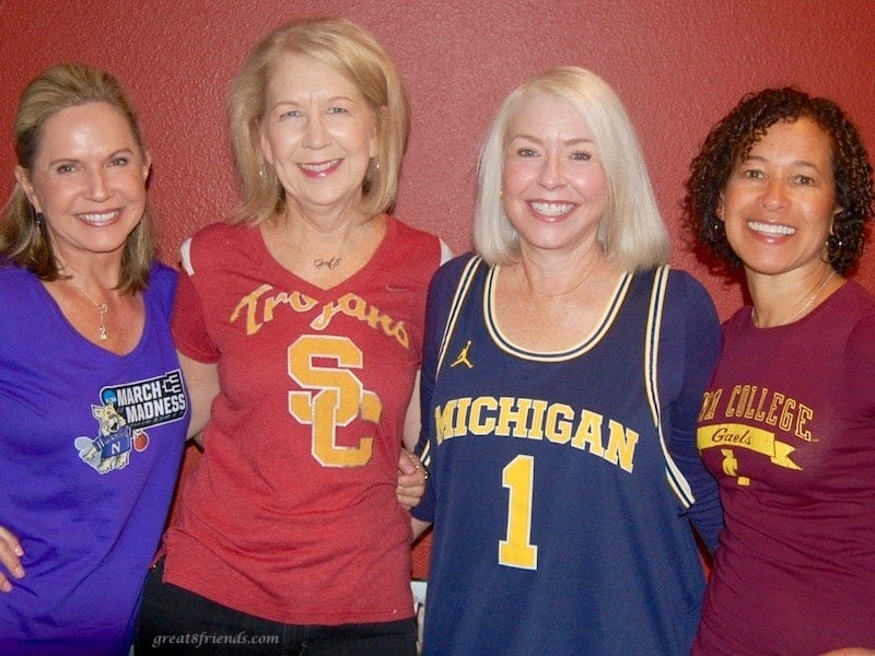 The four of us each in a college shirt, Northwestern March Madness, USC Trojans t-shirt, Michigan basketball tank, Seton Hall College t-shirt.