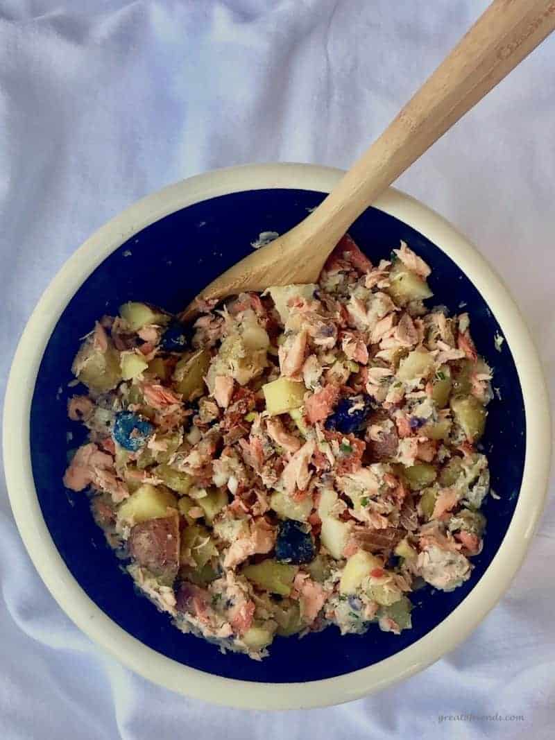 A bowl of salmon hash mixture before forming and cooking.