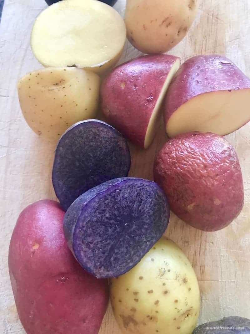 Some tricolor potatoes cut in half.