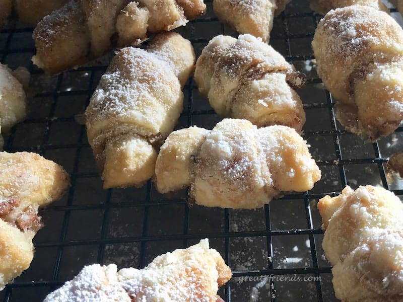 Crescent cookies dusted with powdered sugar.