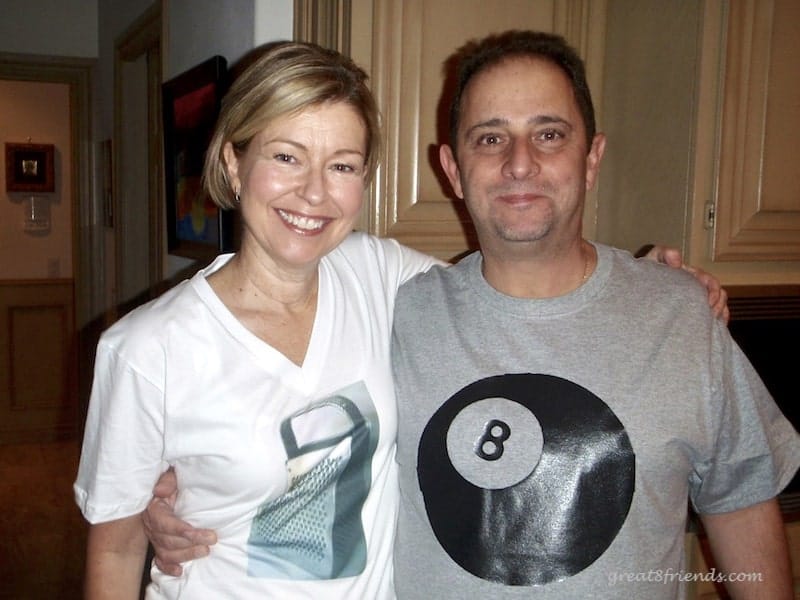 Anna wearing a white t-shirt with a photo of a grater and Vince wearing a gray t-shirt with picture of 8-ball - the Grate 8.