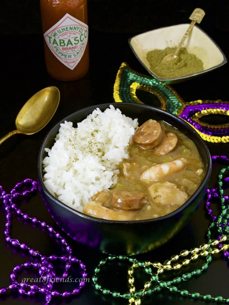 Sausage Shrimp and Chicken Gumbo with rice, Tabasco, Filet powder, and Mardi Gras beads