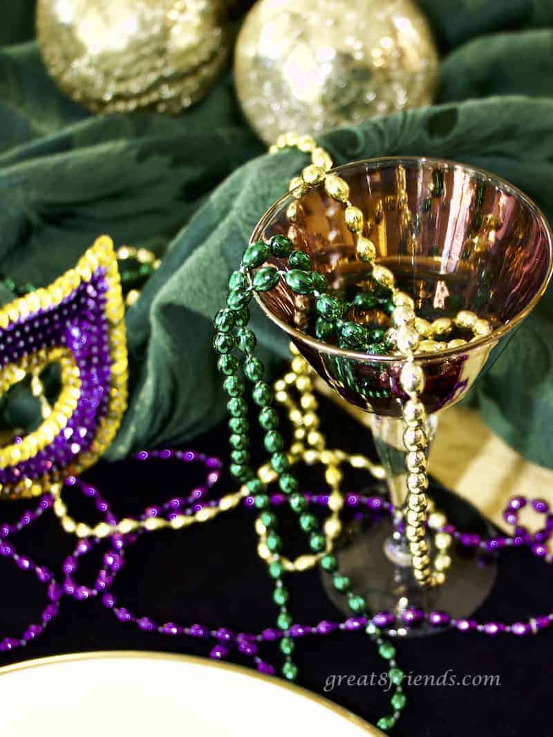 Mardi Gras decorations, beads and goblet.