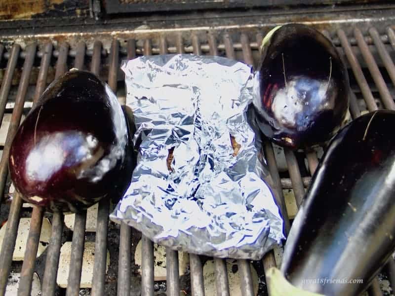 eggplants roasting on the bbq grill
