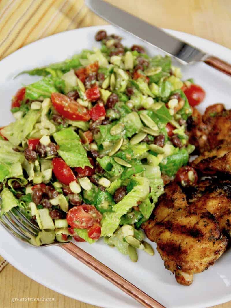 Black Bean Salad with Avocado Lime dressing served with grilled chicken thighs.