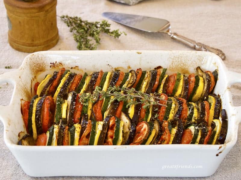 Provençal Vegetable Tian in rectangular casserole with herbs