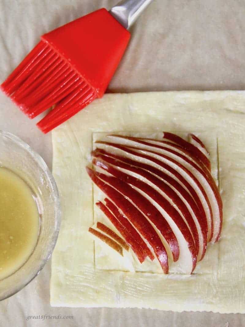 puff pastry pear tart with butter before baking