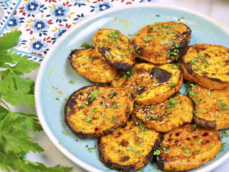 Chili Lime Sweet Potato Fries on blue plate with parsley.