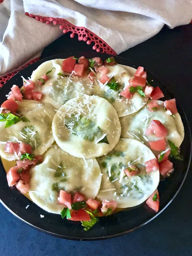 Mushroom and Ricotta Ravioli on a round plate.