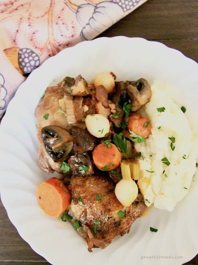 Coq au vin served with mashed potatoes.