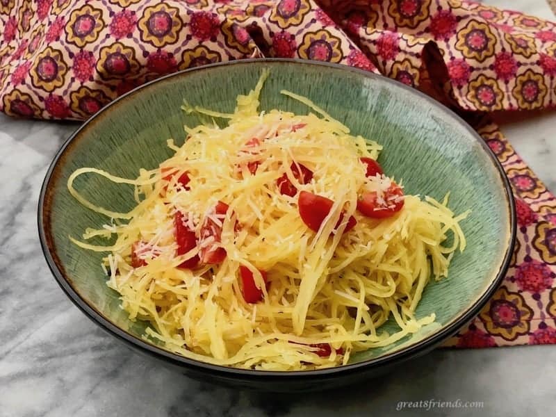 Bowl of spaghetti squash and tomatoes.