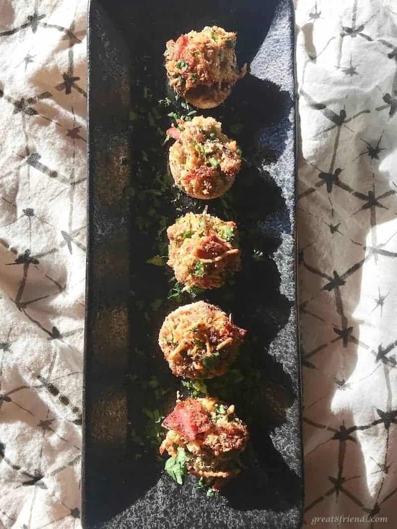 Mushrooms stuffed with parmesan cheese, prosciutto and bread crumbs served as an appetizer or side dish.
