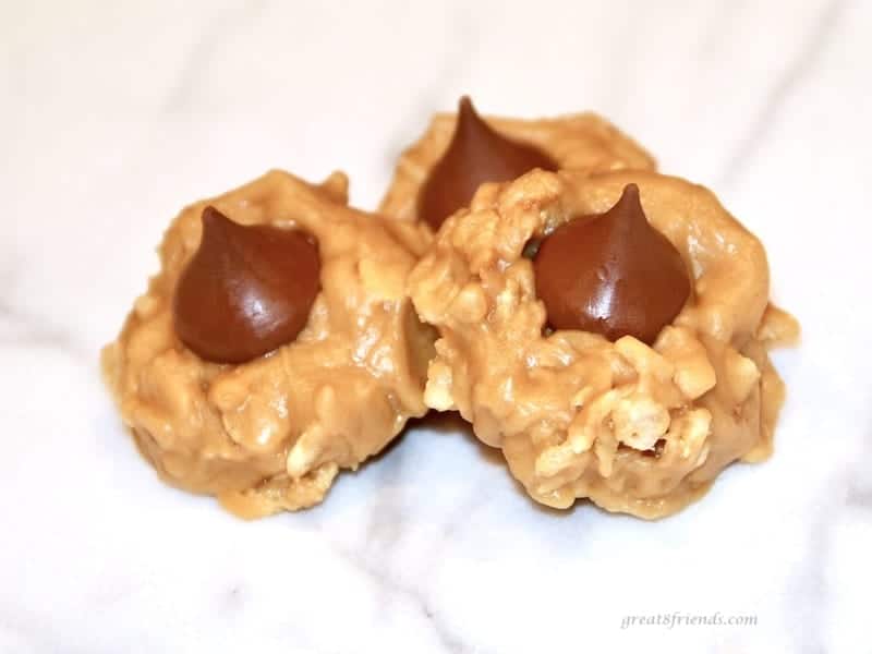 Three no bake peanut butter kiss cookies.