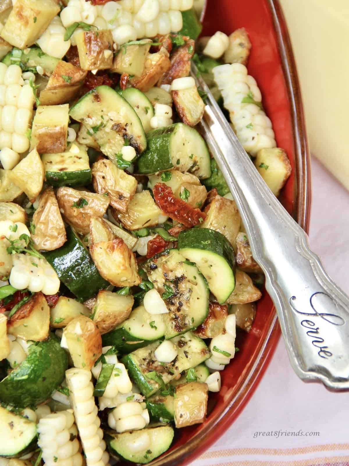 Upclose view of the potato salad with grilled veggies .