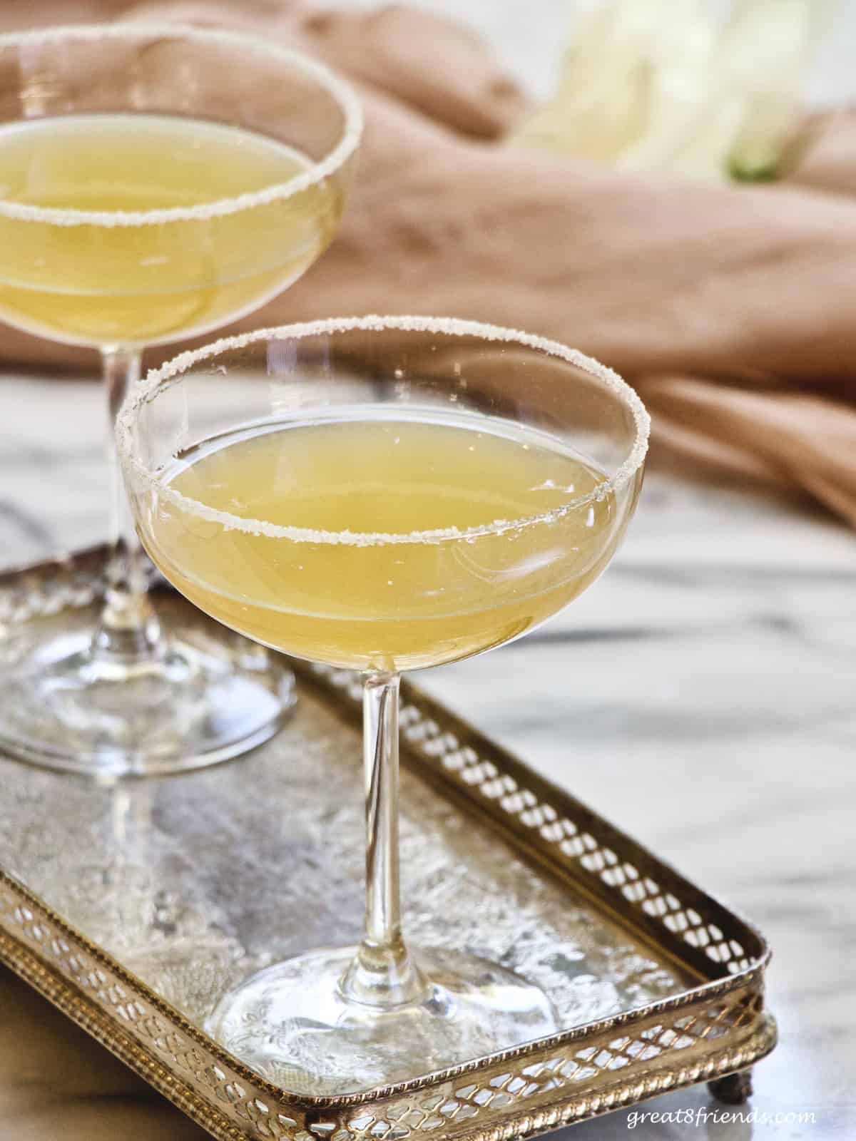 A sidecar cocktail on a silver tray.