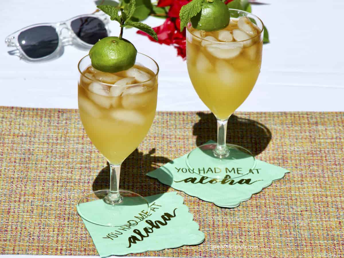 Two mai tais on cocktail napkins that say, "you had me at Aloha."