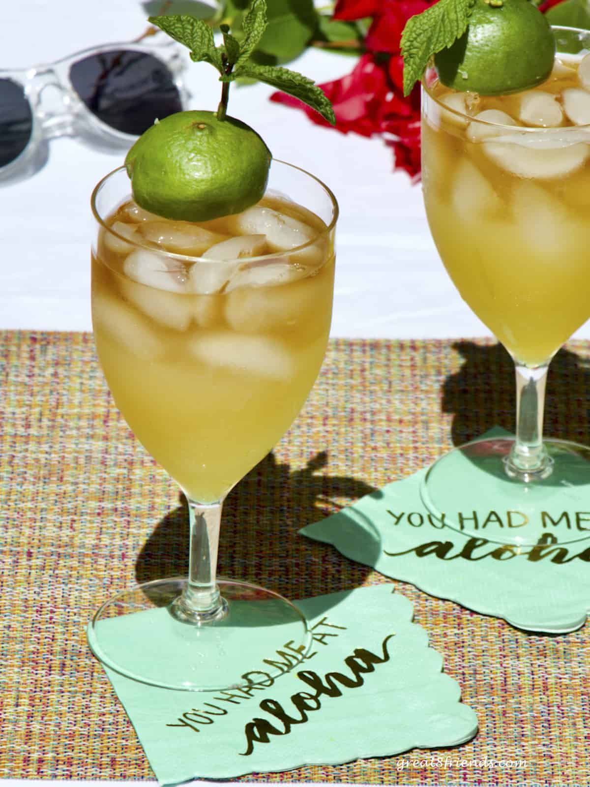 Two mai tais on cocktail napkins that say, "you had me at Aloha."