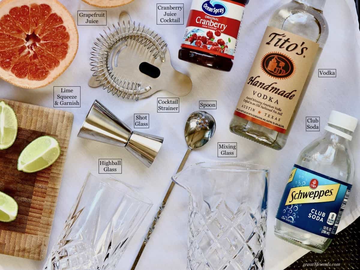 An overhead shot of all the ingredients and equipment for a Nantucket Breeze Cocktail.