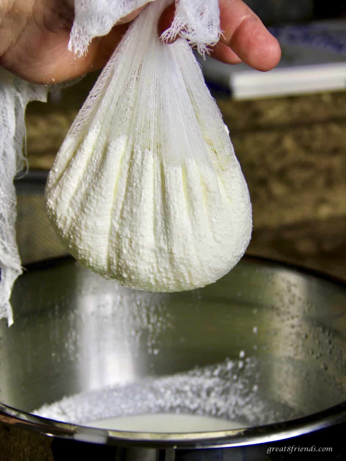 Homemade ricotta in a cheesecloth.