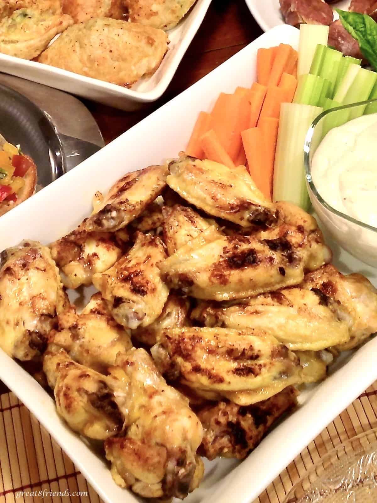 Buffalo chicken wings served as an appetizer with blue cheese dressing.