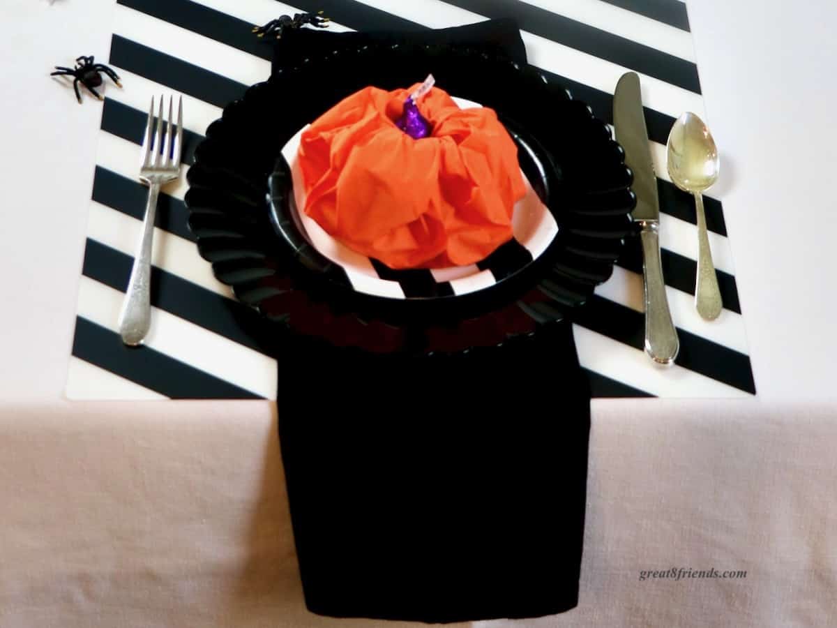 Black white and orange Halloween table setting.