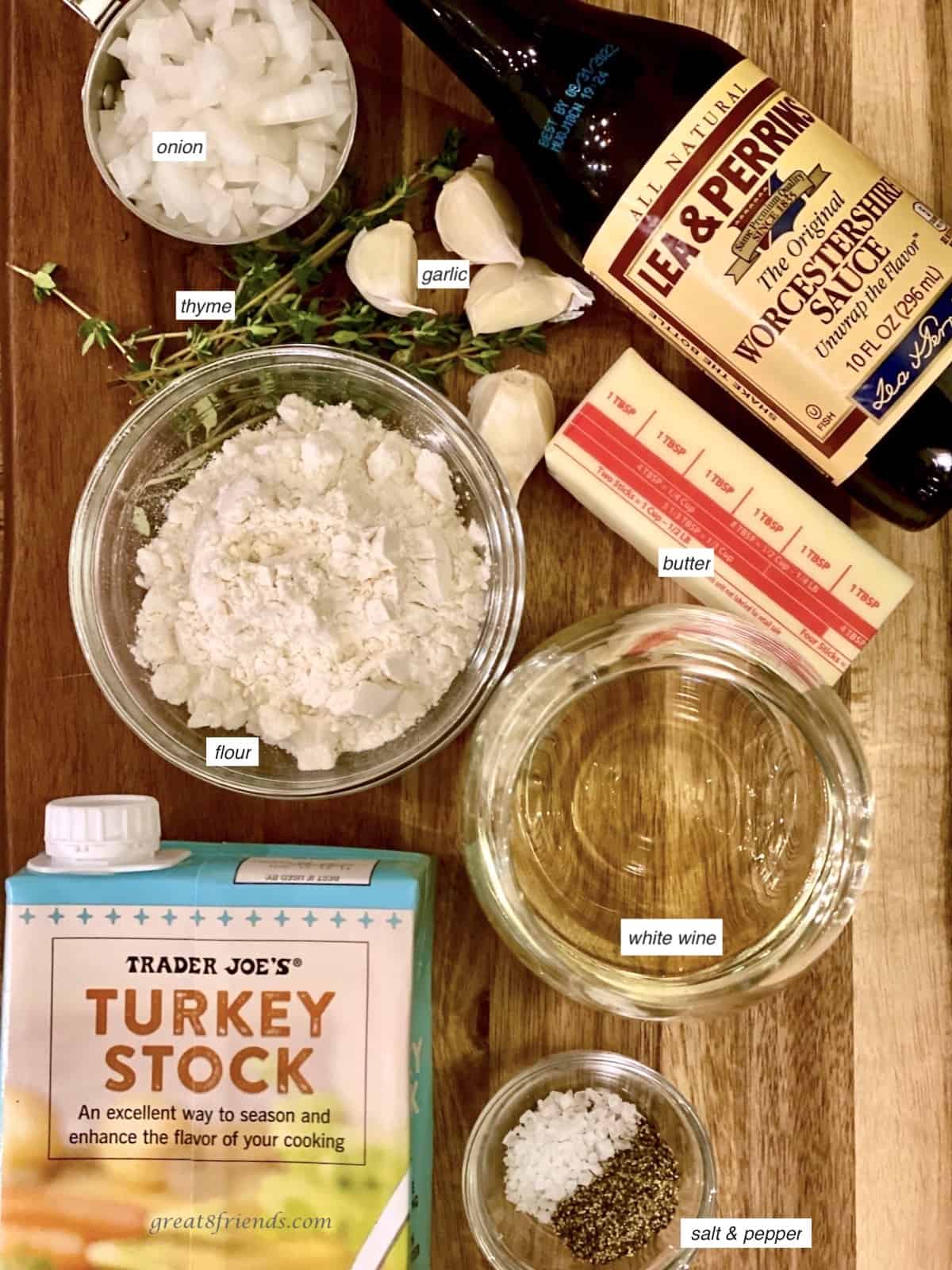 Ingredients laid out including turkey stock, flour, onions, thyme, Worcestershire sauce, butter, salt and pepper.