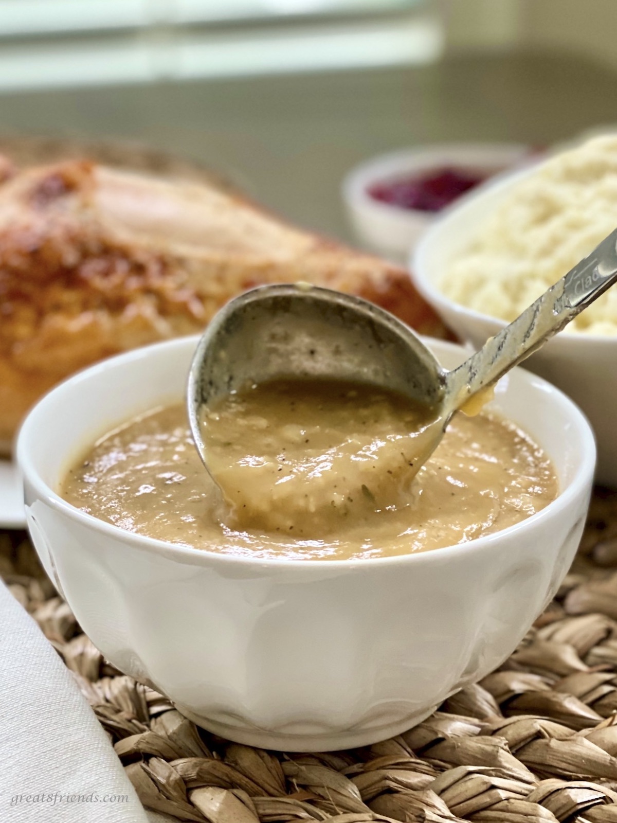 Gravy being served with a ladle.