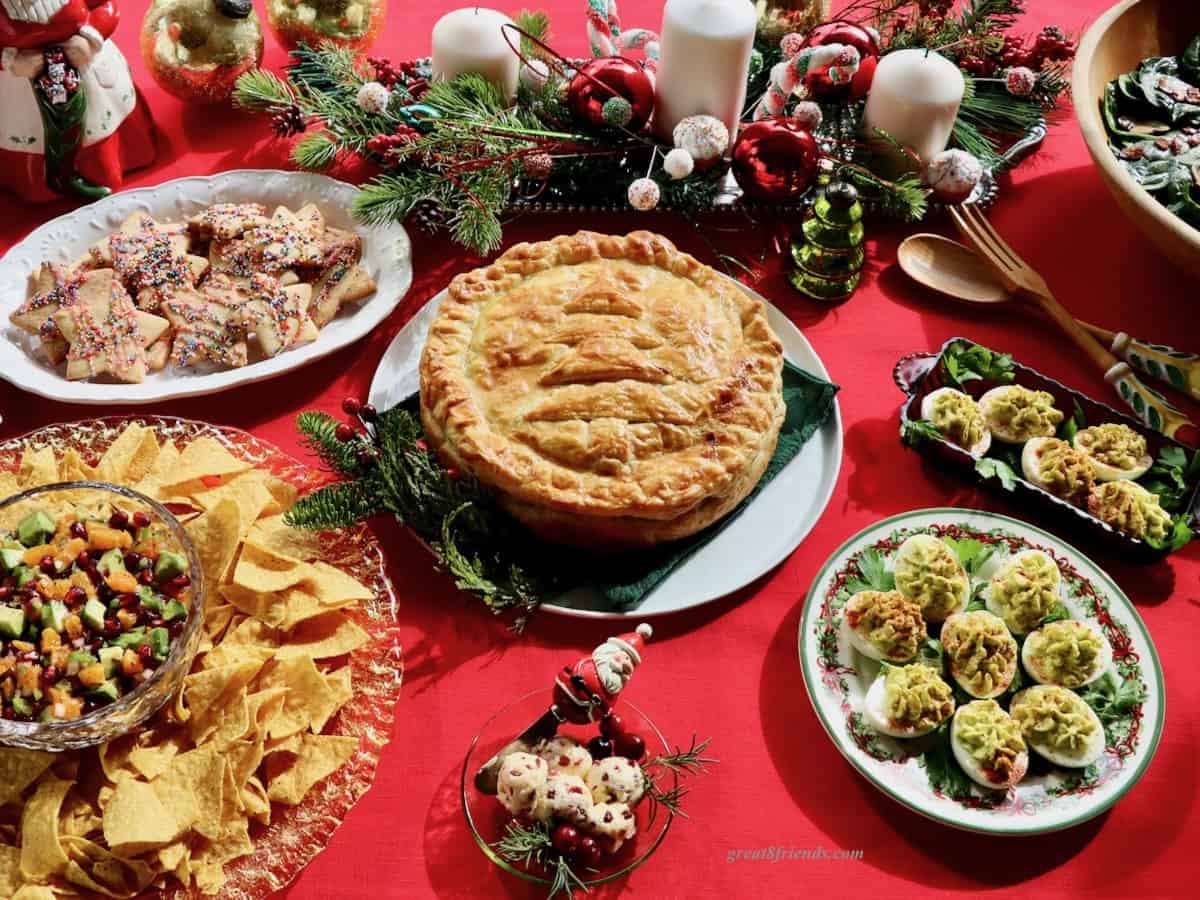 A Christmas brunch buffet on a red tablecloth.