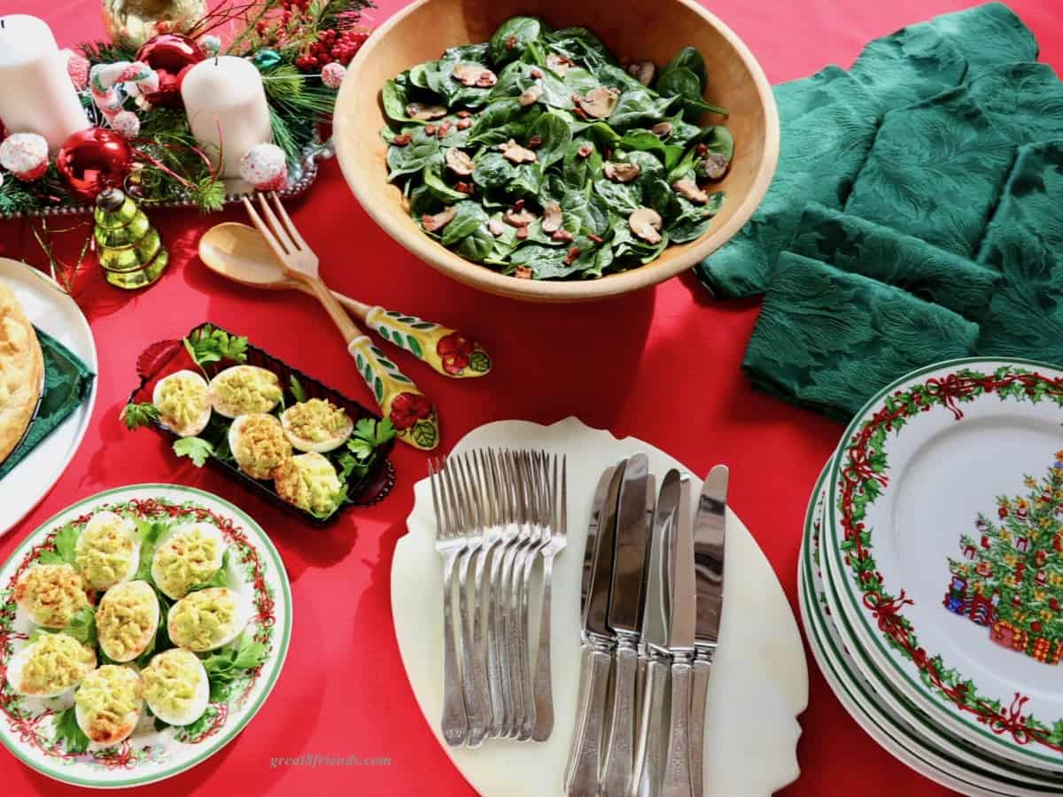 A Christmas brunch buffet on a red tablecloth.
