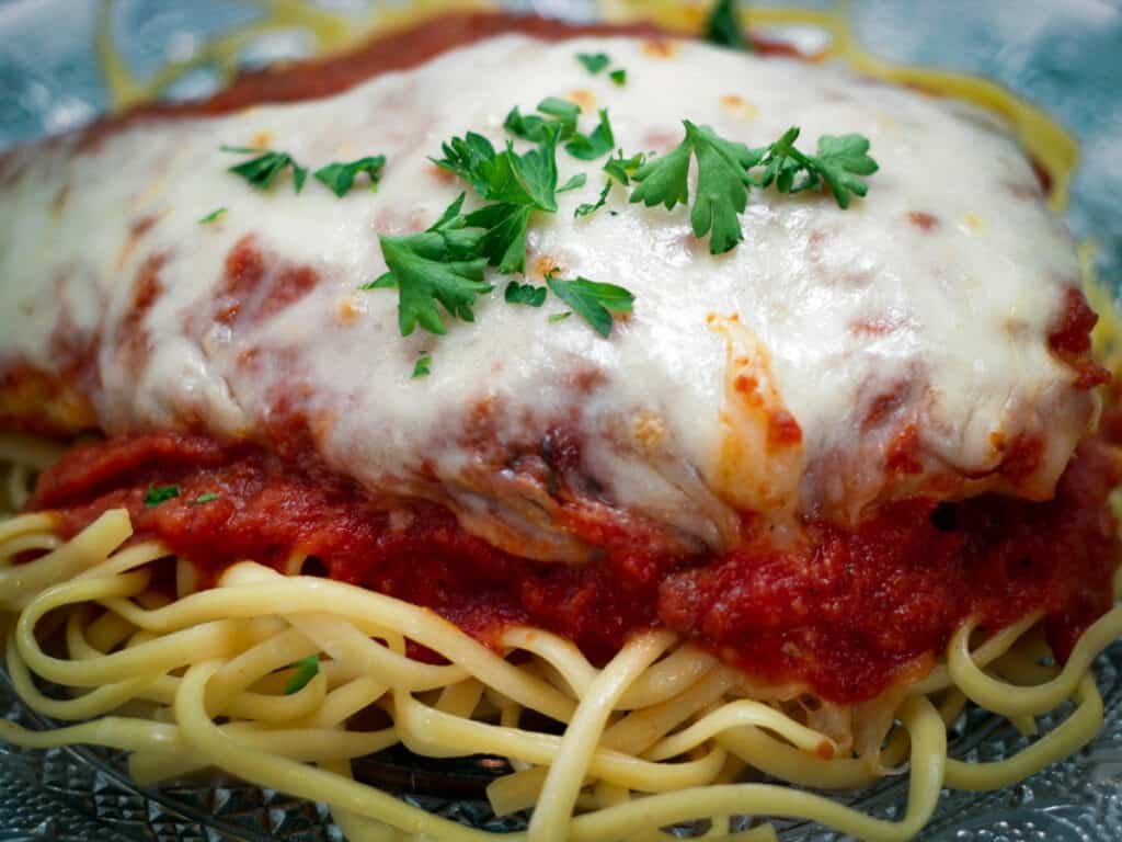 Close up of chicken parma.